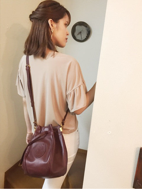 Cartierラグビーボール型巾着ショルダー（ボルドー）